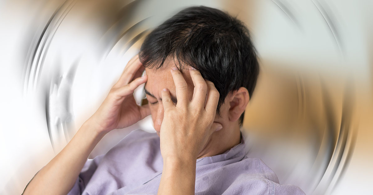 Vertigo illness concept. Man hands on his head felling headache ketamine vs ssris